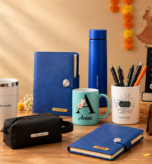 Personalized Navratri corporate gifts for employees and clients with diary, bottle, mug, pen holder and desk accessories.