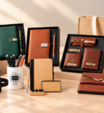 Personalized employee welcome kits with diaries, pens, leather accessories, a water bottle and gift bags.