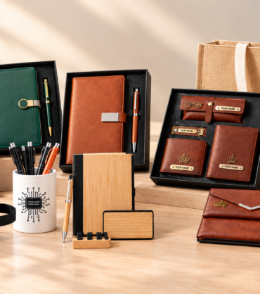 Personalized employee welcome kits with diaries, pens, leather accessories, a water bottle and gift bags.